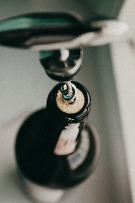 A corkscrew inserted in a wine bottle